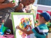 В рамках экспозиции детсада «Ягодка» на Дне поселка была организована мини-акция «Подари цветок добра»