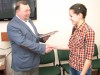 Именную стипендию из рук А.Г. Спирина получает активистка из Кишкина Мария Грошева
