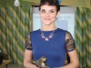 Символ защиты детей — лесная птица — в руках победительницы конкурса Марины Грачевой